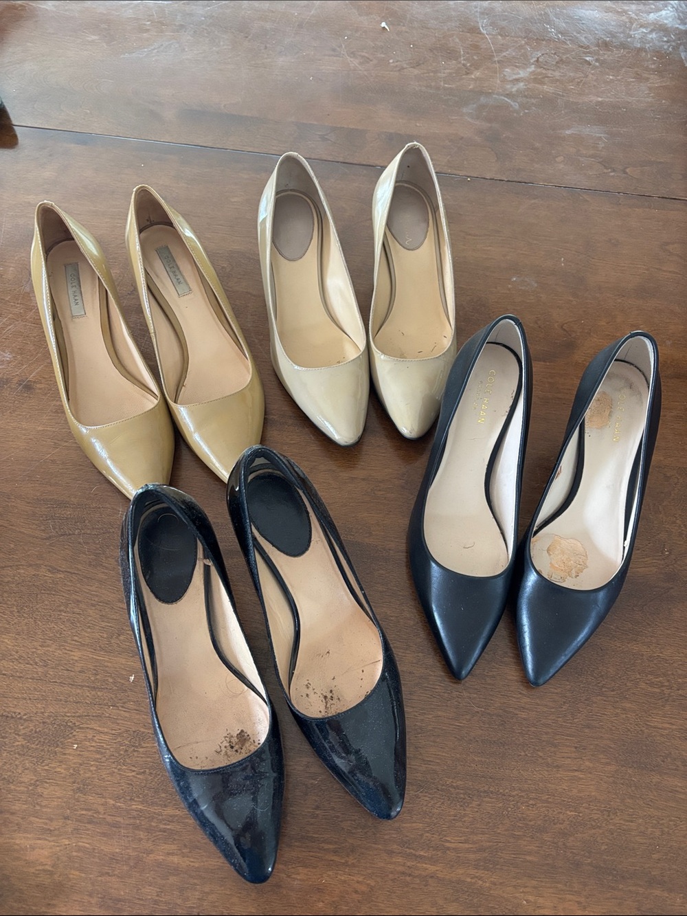 Cole Haan Pointed-Toe Pumps in Black, Beige, and Tan
